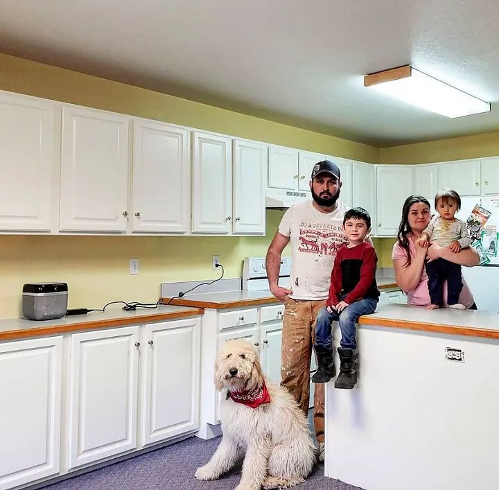 Happy family in their newly refinished kitchen
