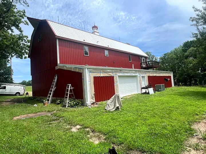 A classic red barn painted by Red Barn Painting